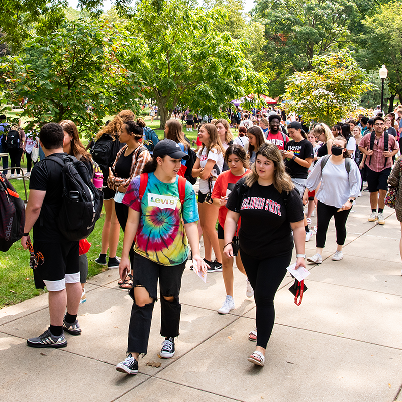students walking through the Festival ISU.
